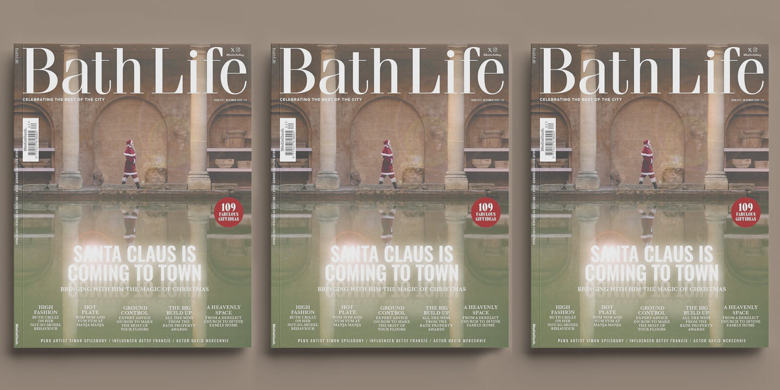 Cover of Bath Life magazine featuring Santa Claus walking by a stone archway reflected in a calm pool. Headline: "Santa Claus is Coming to Town." Festive theme.