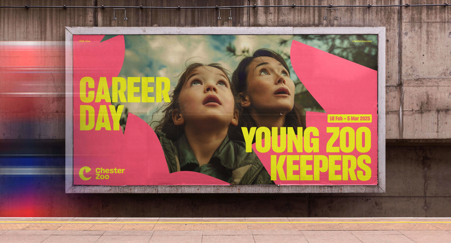 Billboard promotes Chester Zoo's "Career Day: Young Zoo Keepers, 18 Feb - 5 Mar 2025." Shows a child and woman gazing upwards, conveying wonder.