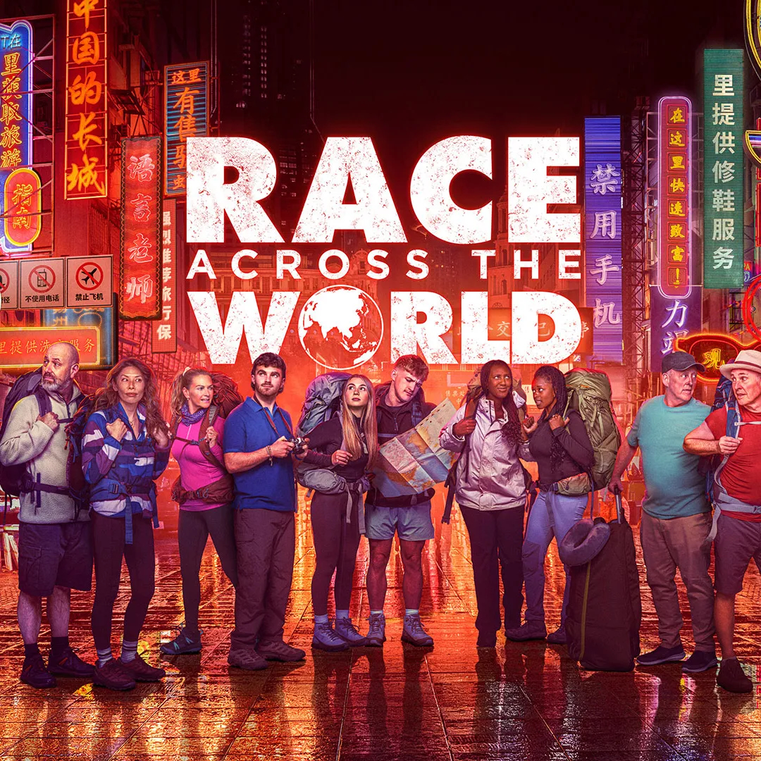 A diverse group of travelers, each with backpacks, stand in a neon-lit urban street. The bright, colorful signs create an adventurous and energetic mood. The text "Race Across the World" is prominently featured above them.